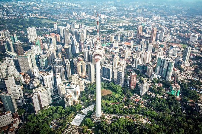 Kuala Lumpur Tower Admission Ticket with Private Hotel Pickup - Add-ons beyond the tower: Upside-Down House, XD Theatre, F1 Simulator