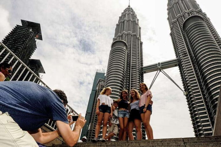 Private KL City Tour with Petronas Twin Towers & Batu Caves - Batu Caves: Lord Muruga, temple caves, and the stairs reality check