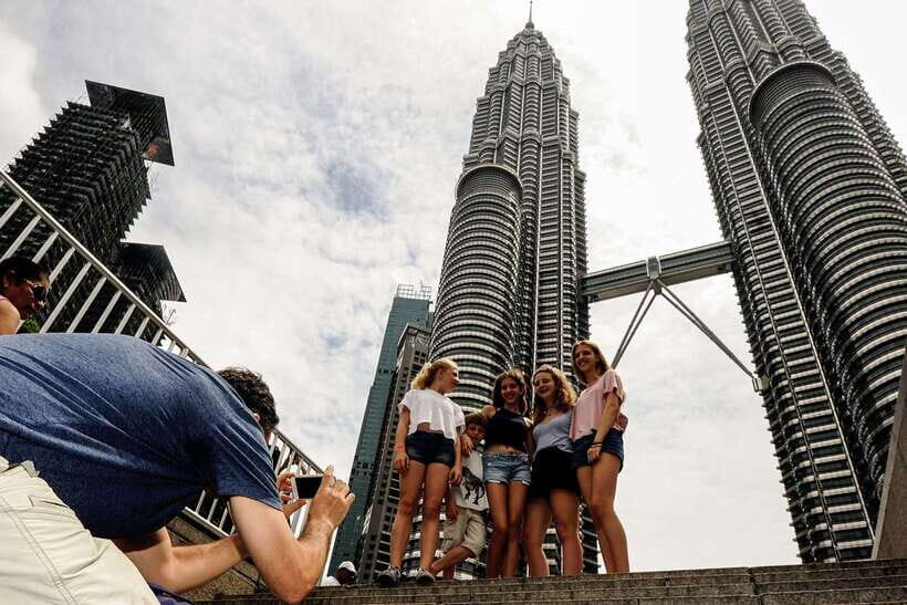 Private KL City Tour with Petronas Twin Towers & Batu Caves - Batu Caves: Lord Muruga, temple caves, and the stairs reality check